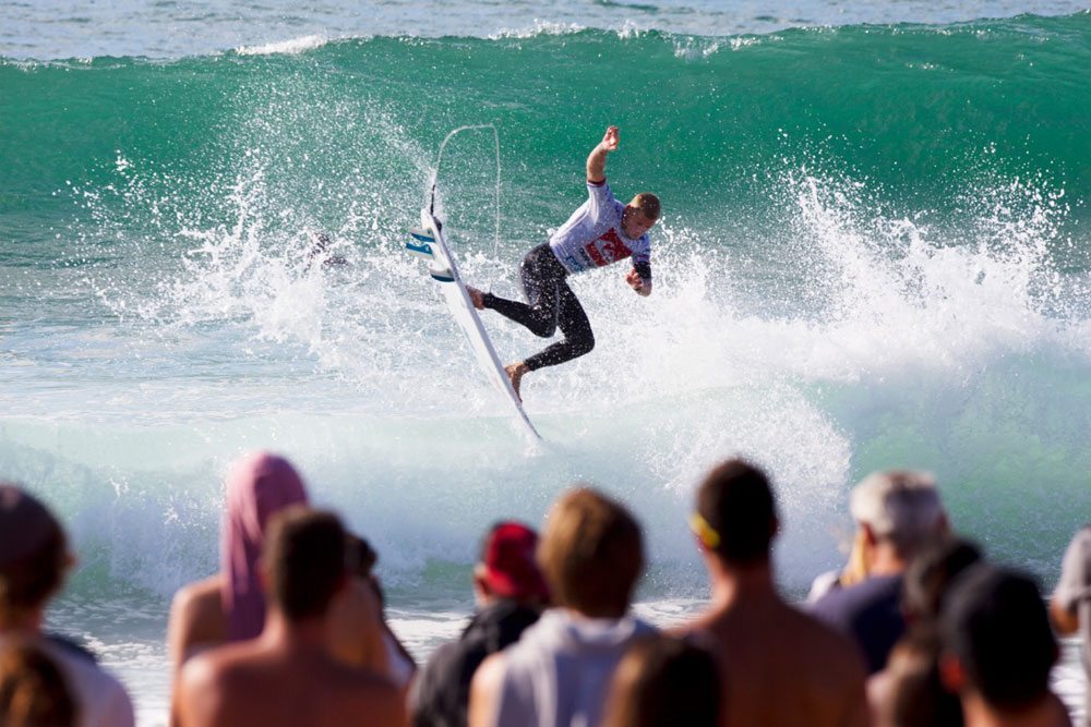 Surfer Mick Fanning gets airborne at the Quik Pro France